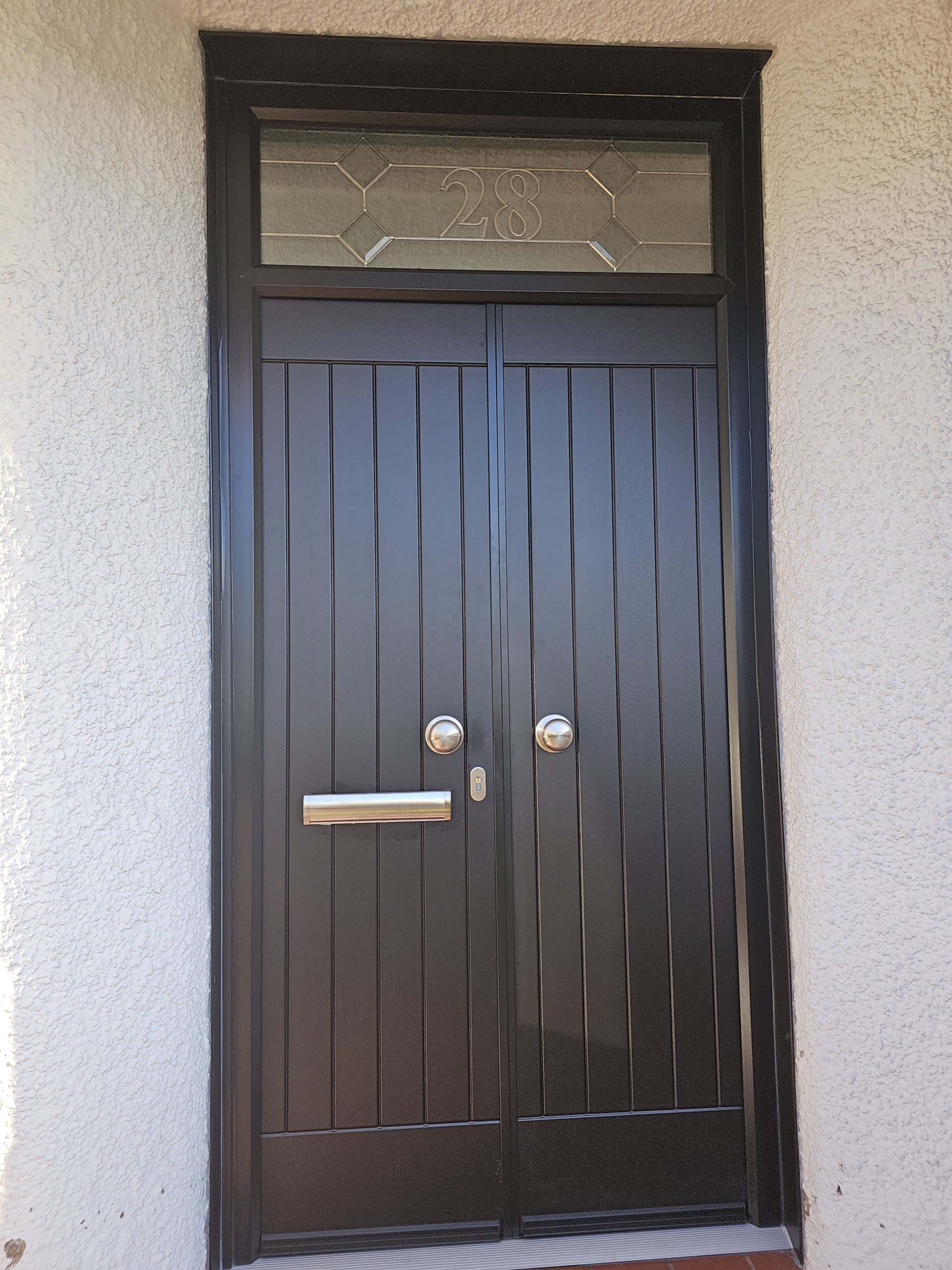 Composite Storm Doors in Black with Custom Fan Light